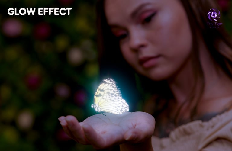 Woman holding a glowing luminescent butterfly in her palm with blurred colorful lights in the background