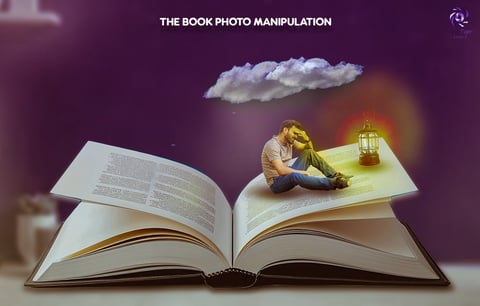 Open book with surreal imagery showing a miniature person sitting on a page with a glowing lantern and cloud above