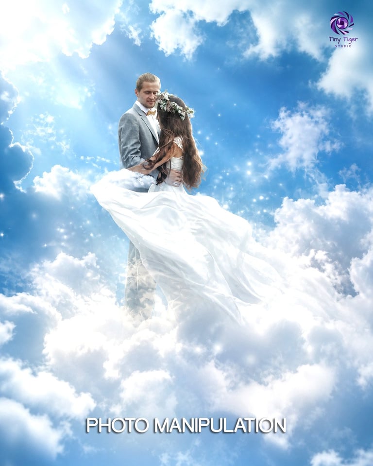 Groom holding bride in white dress floating on clouds in sky, fantasy photo manipulation