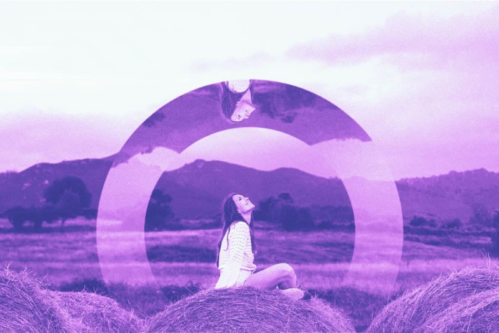 Woman sitting in purple lavender field with double exposure circular overlay effects creating an ethereal artistic composition